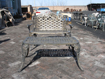 Tabella e sedie moderne del ghisa con l'insieme pranzante all'aperto del ghisa di colore del bronzo dell'oggetto d'antiquariato